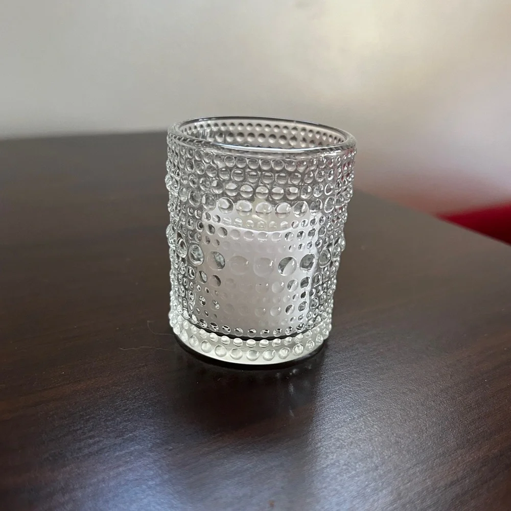 Set of 18 glass votive candle holders with tea lights